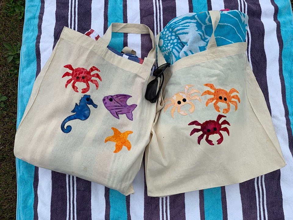 Summer Loving beach bags on towel