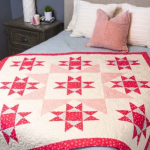 pq11865-qube-12in-stars-in-the-crown-throw-quilt_lifestyle_web