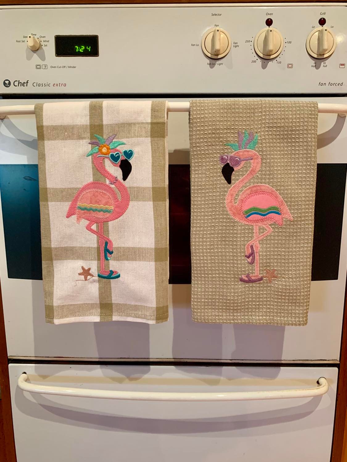 Flamingo towels on oven